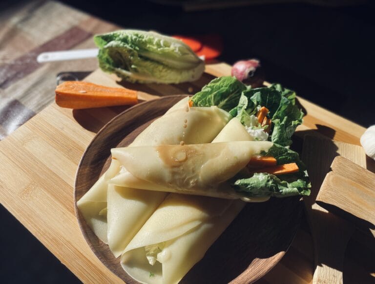 Three fresh lumpia salad on a plate.